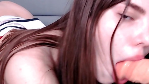 A Girl Sucks A Toy With Pleasure